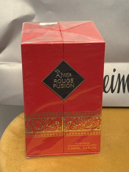 Noticed Atelier by Legzdiamond Ahuja Rouge Fusion Eau de Parfum in a sealed red box with gold ornate detailing.