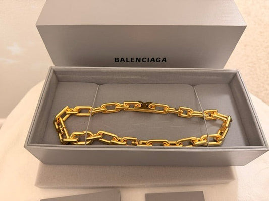 Noticed Atelier by Legzdiamond authentic Balenciaga gold chain choker in its original branded presentation box.