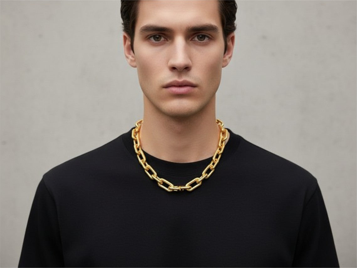 Noticed Atelier by Legzdiamond authentic Balenciaga gold chain choker worn by a man in a black t-shirt