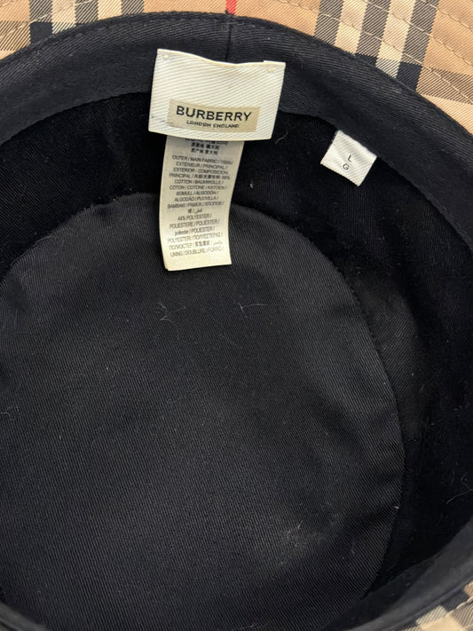 Interior view of Noticed Atelier by Legzdiamond Burberry bucket hat showing brand label and size L tag