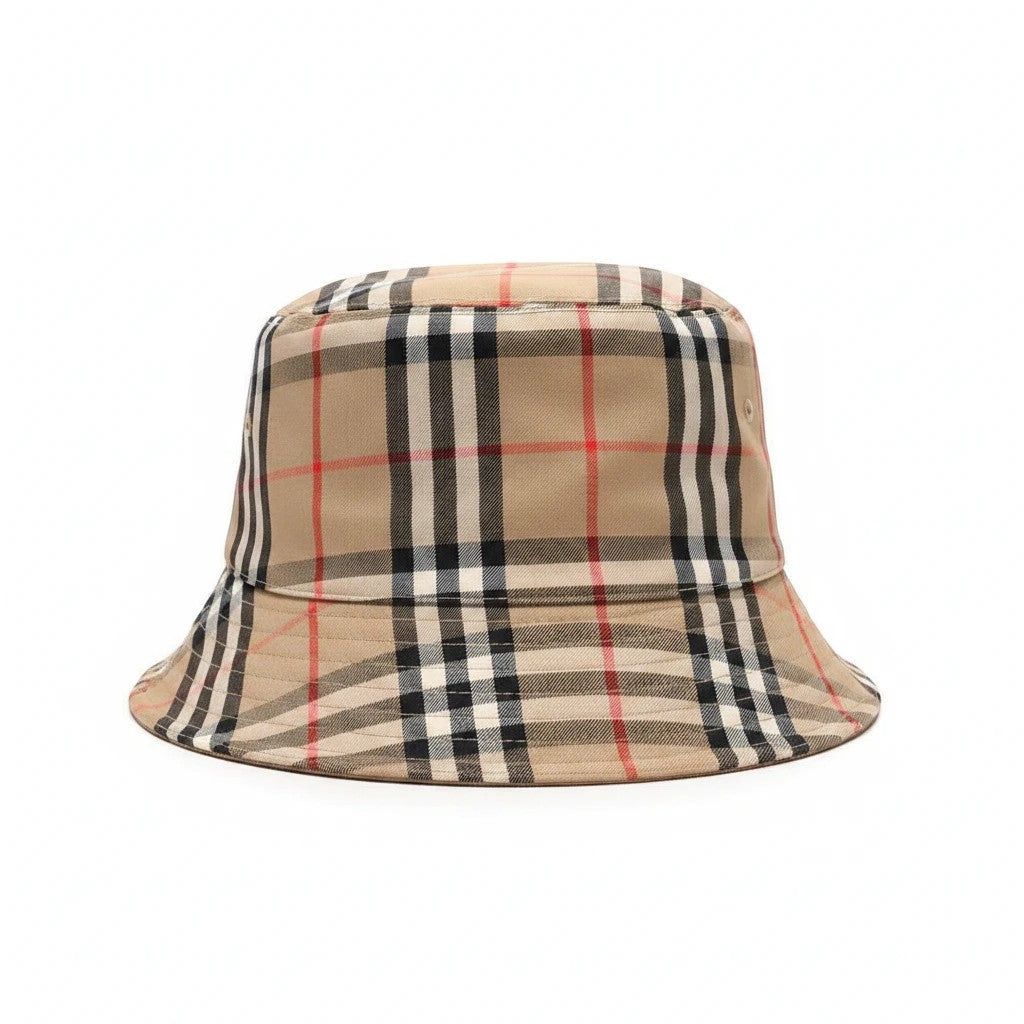 Noticed Atelier by Legzdiamond Burberry classic check bucket hat in beige, black, and red cotton blend fabric.