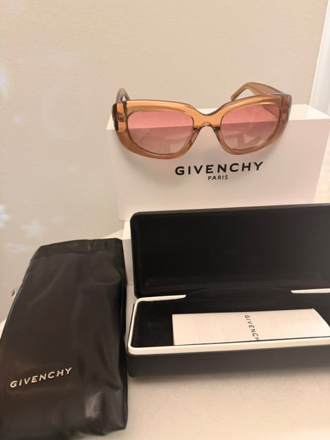 Noticed Atelier by Legzdiamond Givenchy caramel frames with clear caramel tinted lenses and branded case and box.