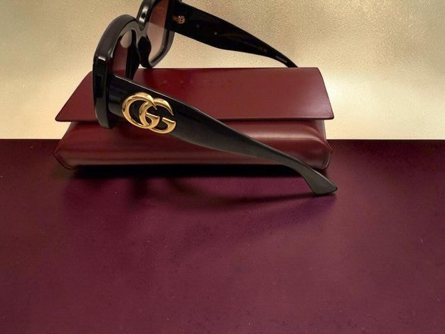 Noticed Atelier by Legzdiamond Gucci black frames with rose gold tinted lenses and iconic gold GG logo on the temple
