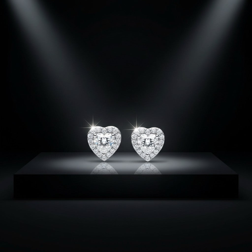 Noticed Atelier by Legzdiamond heart shaped diamond stud earrings with a halo setting on a black pedestal