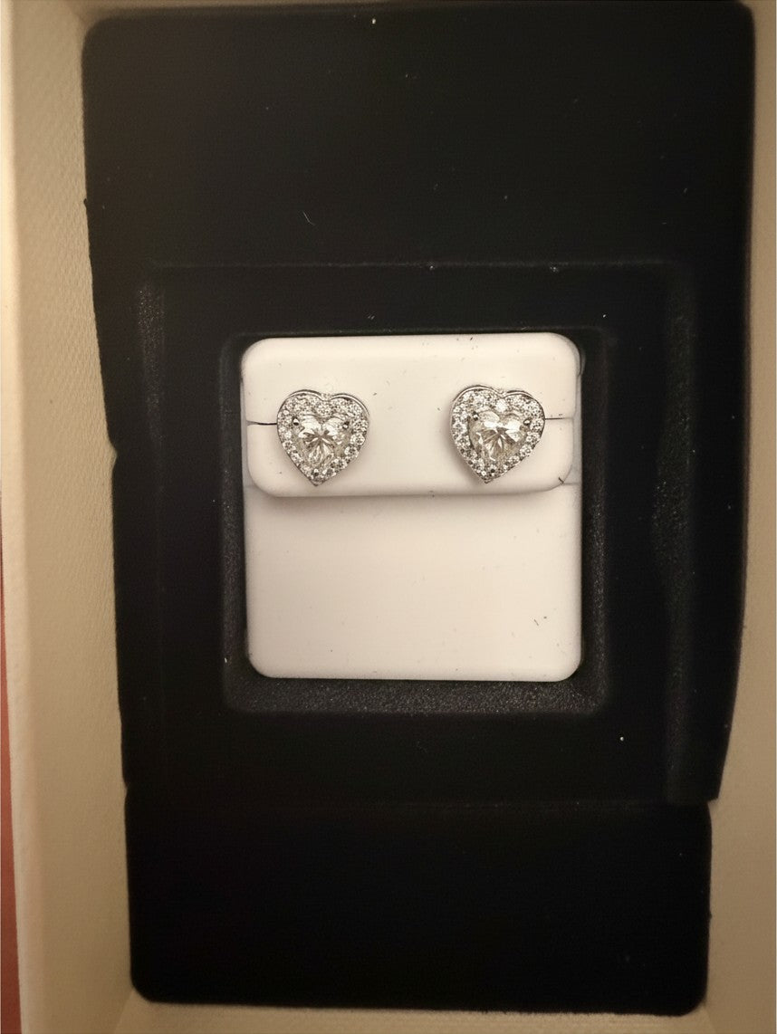 Noticed Atelier by Legzdiamond heart-shaped diamond stud earrings with a halo setting in a black presentation box