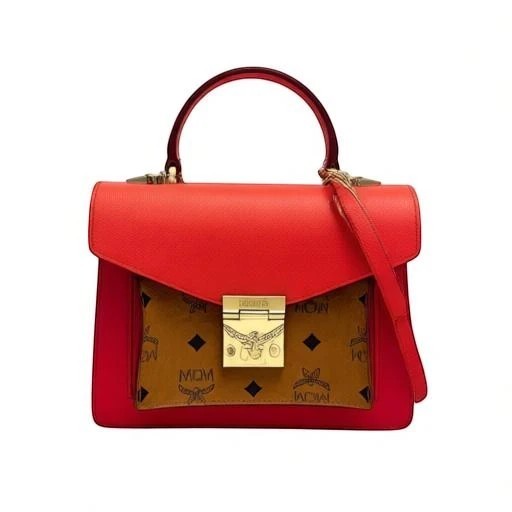 Noticed Atelier by Legzdiamond MCM Mini Tracy crossbody bag in coral red leather with cognac Visetos monogram panel.