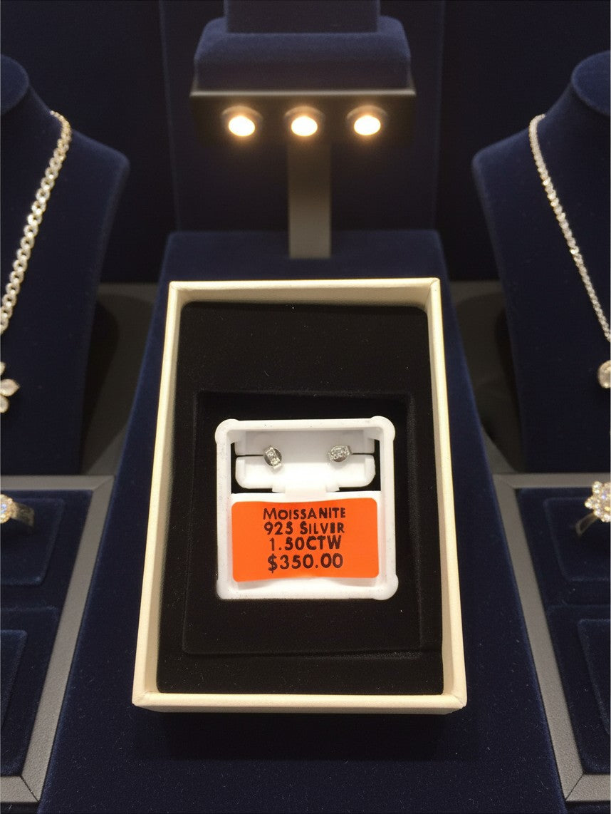 Noticed Atelier by Legzdiamond moissanite stud earrings set in 925 silver, displayed in a white jewelry box.
