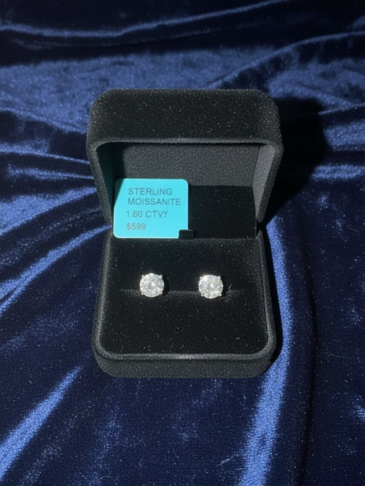 Noticed Atelier by Legzdiamond 1.60 CTW round-cut moissanite stud earrings in sterling silver, set in a black box.