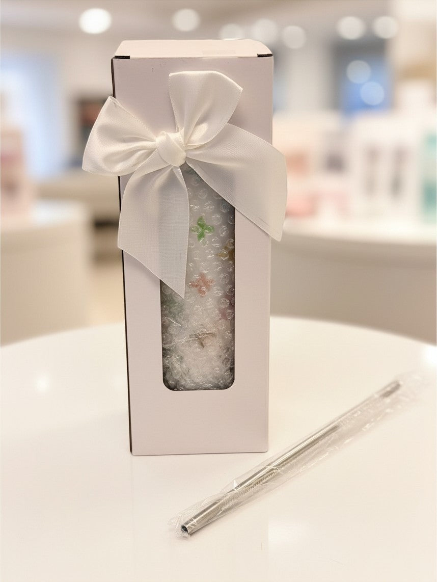Noticed Atelier by Legzdiamond luxury monogram slim tumbler in a white gift box with a satin ribbon and metal straw.