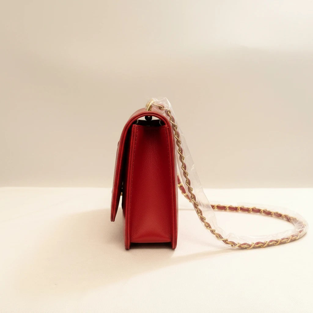 Noticed Atelier by Legzdiamond Badgley Mischka brick red vegan leather crossbody bag with gold chain strap side view