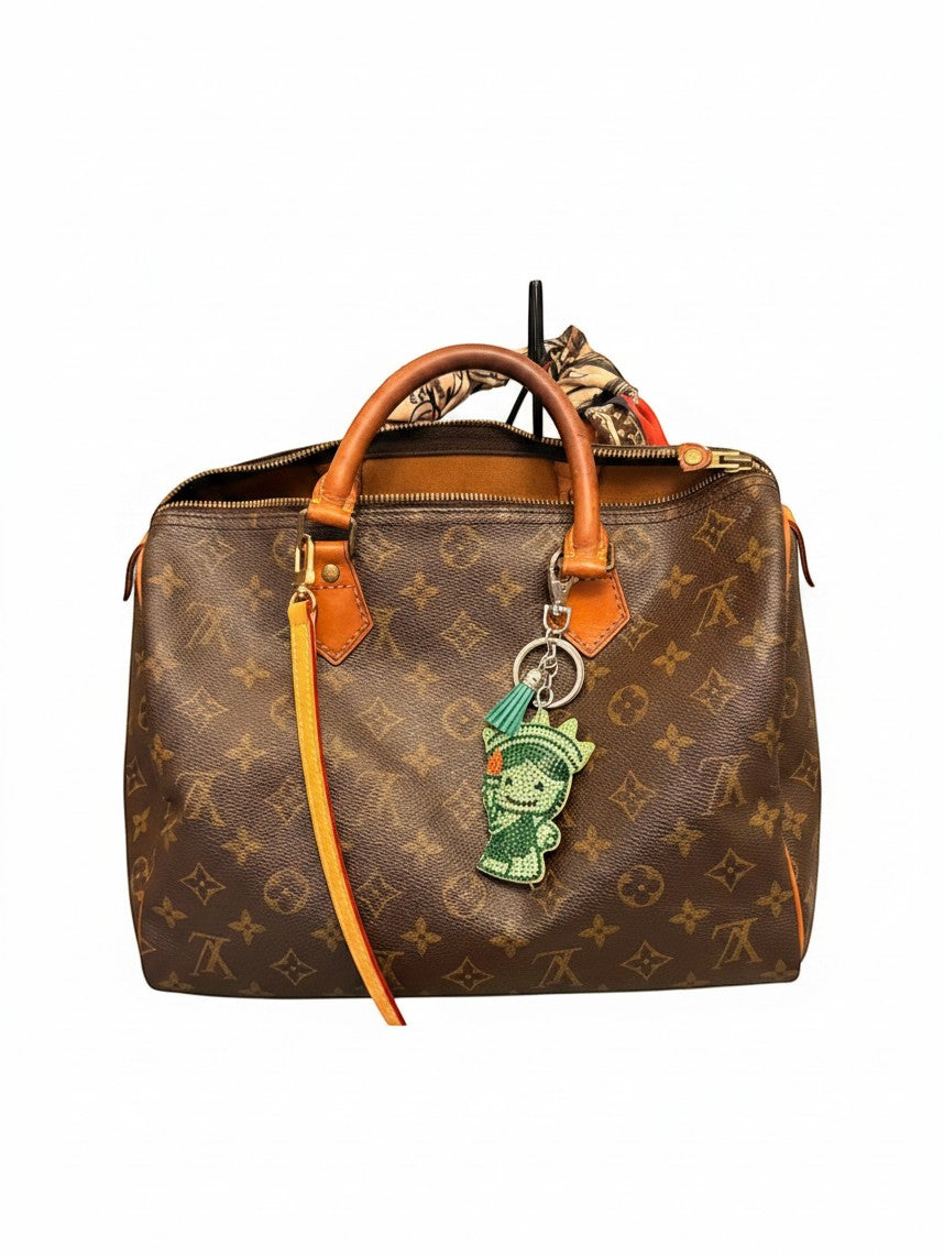 Noticed Atelier by Legzdiamond vintage Louis Vuitton Speedy 30 in monogram canvas with vachetta leather and accessories