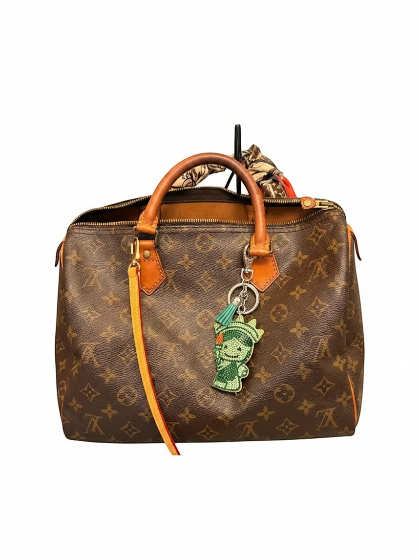 Noticed Atelier by Legzdiamond vintage Louis Vuitton Speedy 30 in monogram canvas with vachetta trim and bag charm